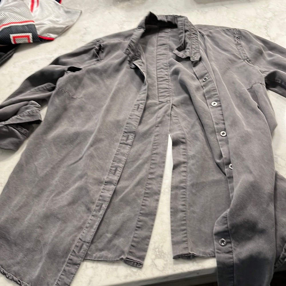 DEX button down grey shirt with split back and open slots on arms.Great w/ jeans